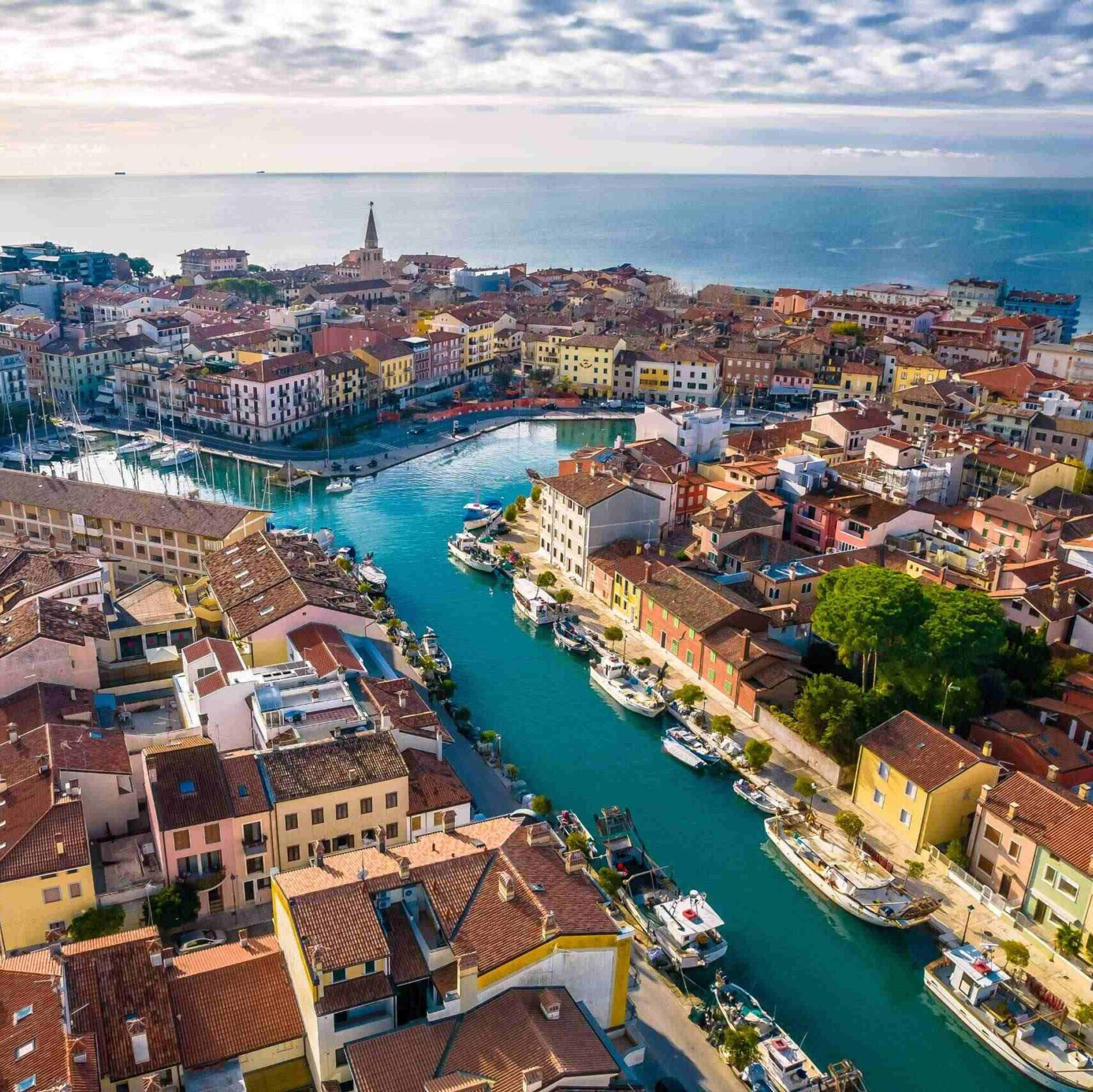 Town of Grado colorful architecture and channels aerial view, Friuli-Venezia Giulia region of Italy
