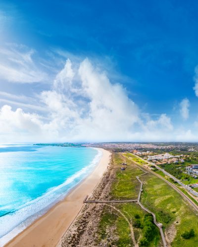 Meia Praia, Lagos beach surfing, drone aerial view in Algarve of Portugal