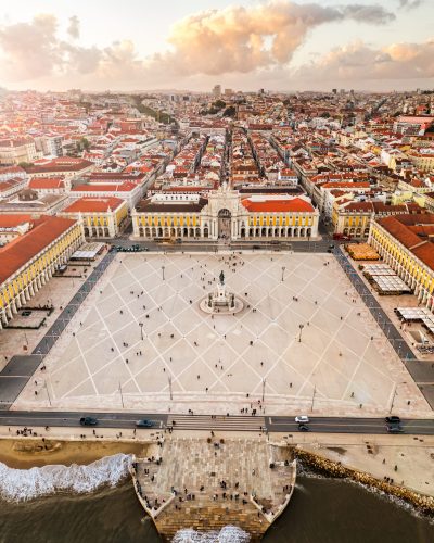 Panorama central commerce square palace terrace, Lisbon, Portugal at sunset, old european city, drone view, vertical air photo